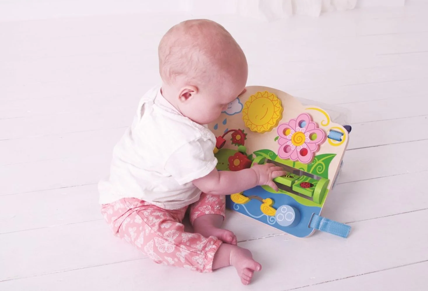 Bigjigs Toys Dřevěná motorická deska květy