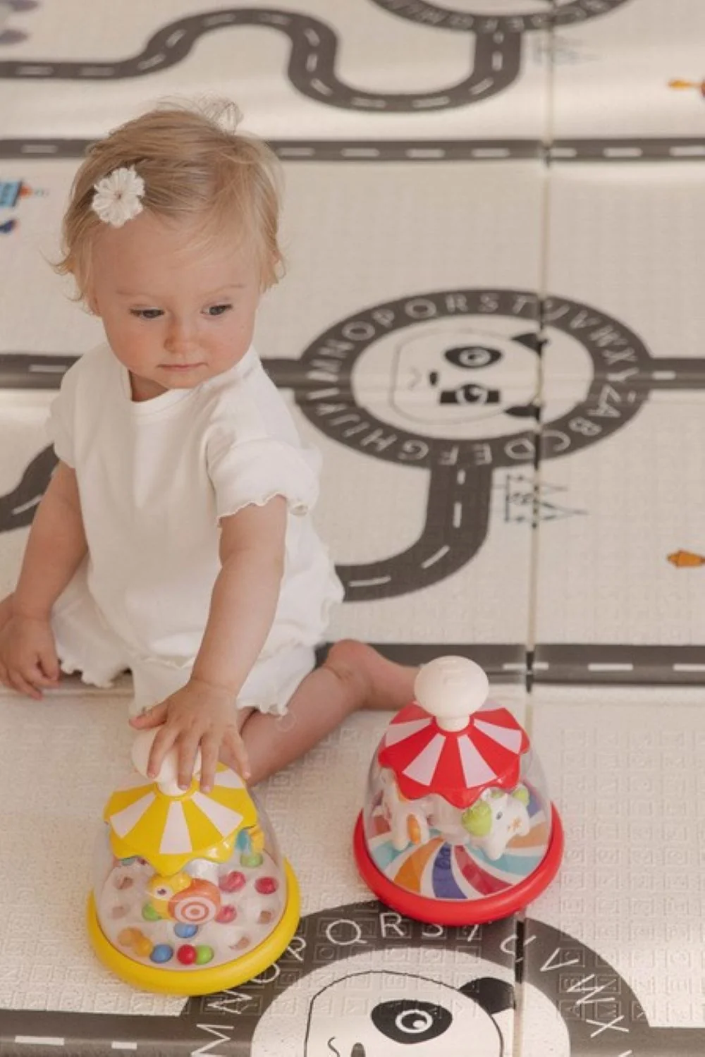 Toyz Toyz Edukační hračka Káča s koníky – červená, kolotoč, 6m+