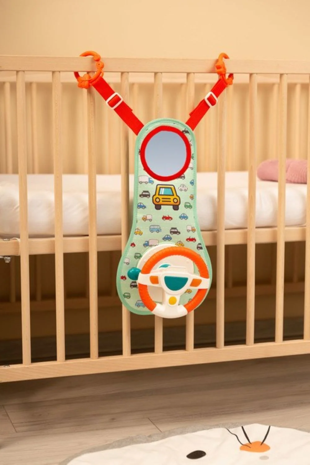 Toyz Závěsná edukační hračka s volantem - zelená, oranžová