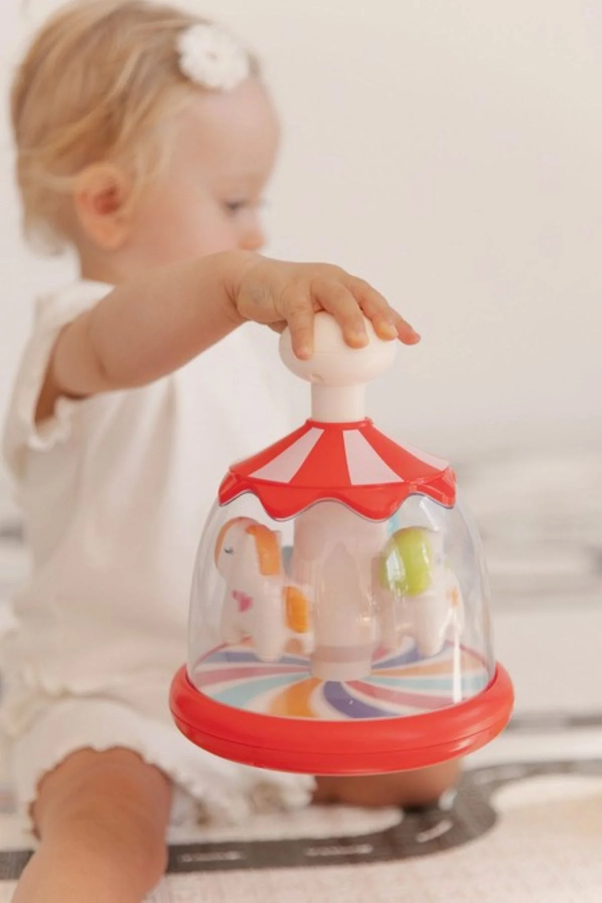 Toyz Toyz Edukační hračka Káča s koníky – červená, kolotoč, 6m+