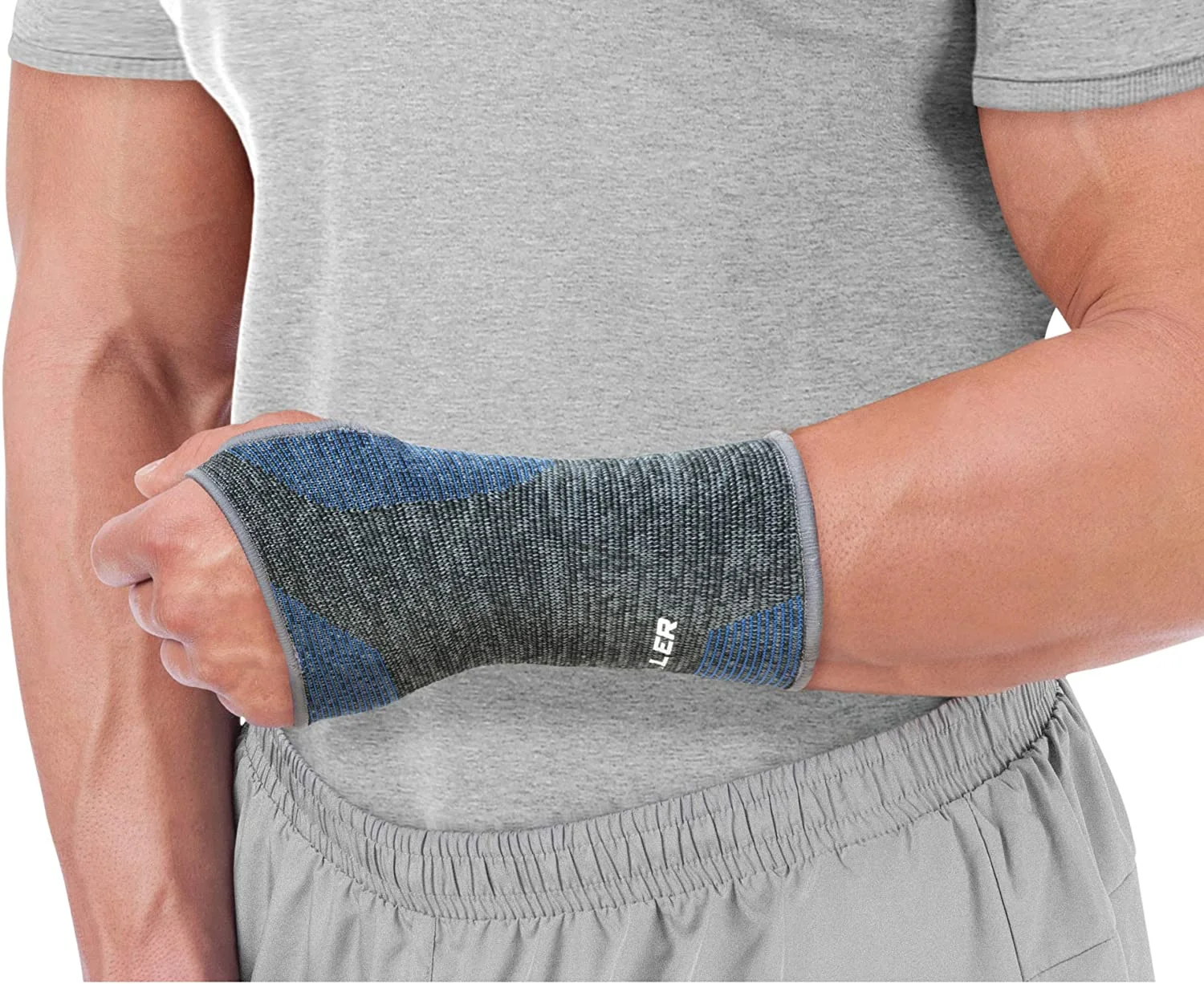 Mueller 4-Way Stretch Premium Knit Wrist Support, bandáž na zápěstí, Velikost: M/L Velikost: M/L