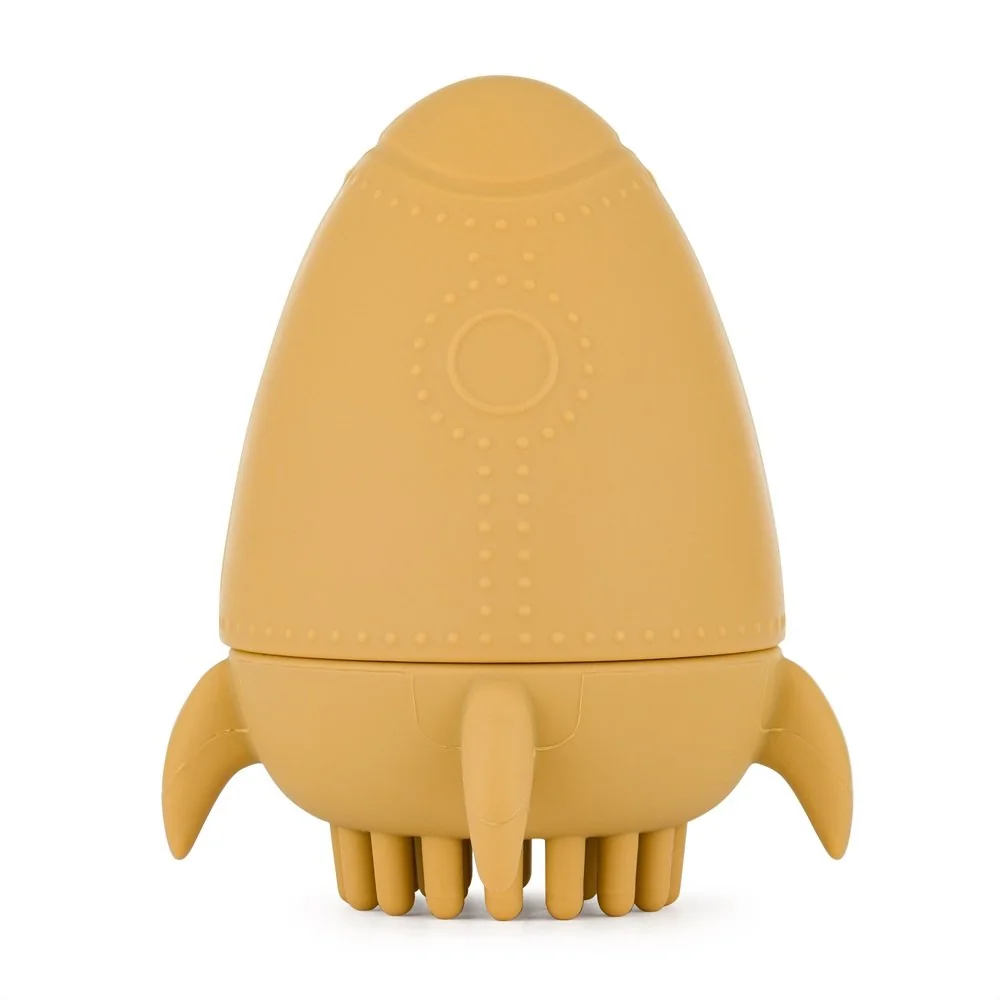 Petite&Mars Hračka silikonová do vody s kartáčkem Splashy Rocket Intense Ochre 6m+