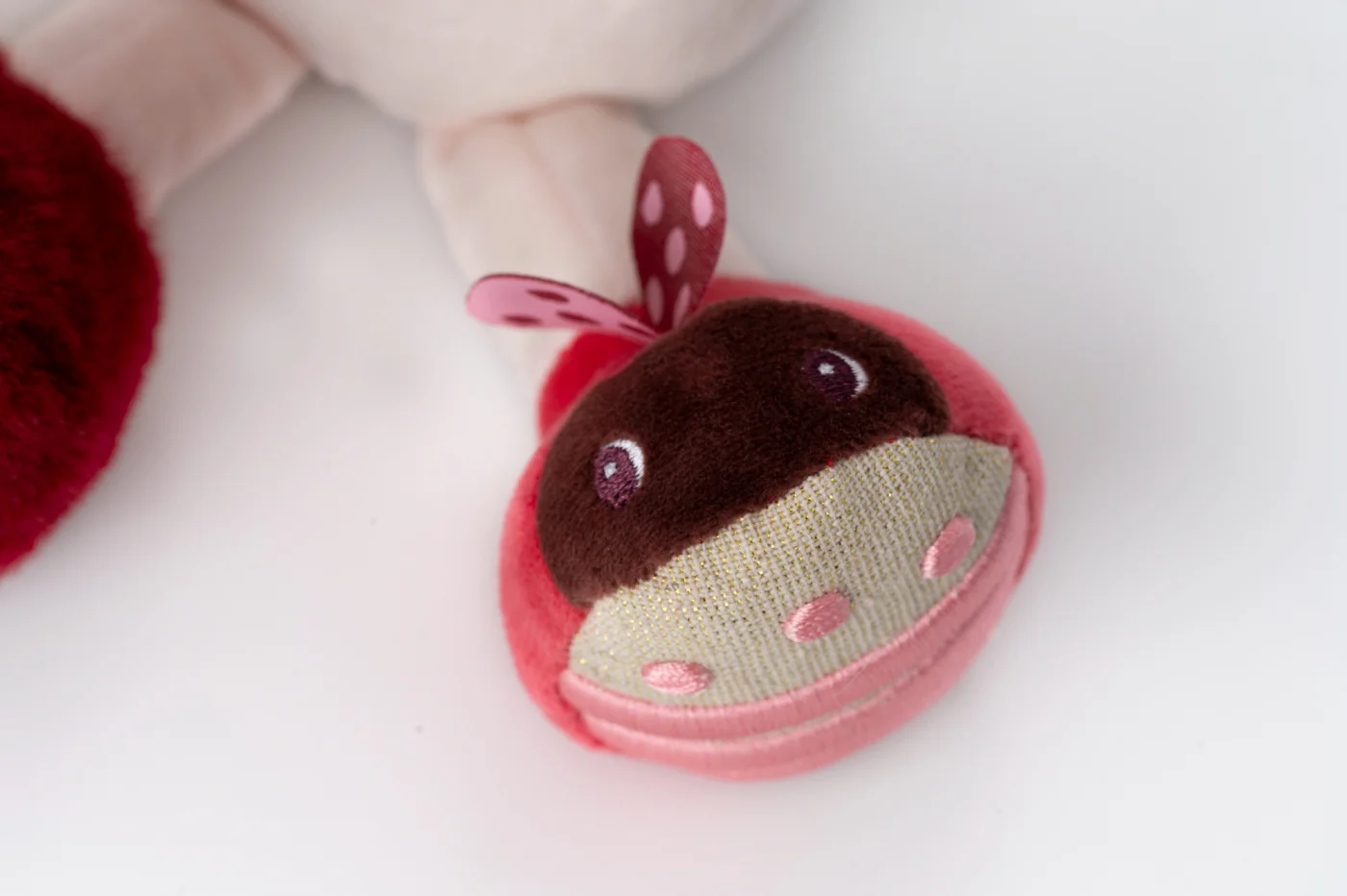 Lilliputiens textilní hračka s aktivitami - jednorožec Lena